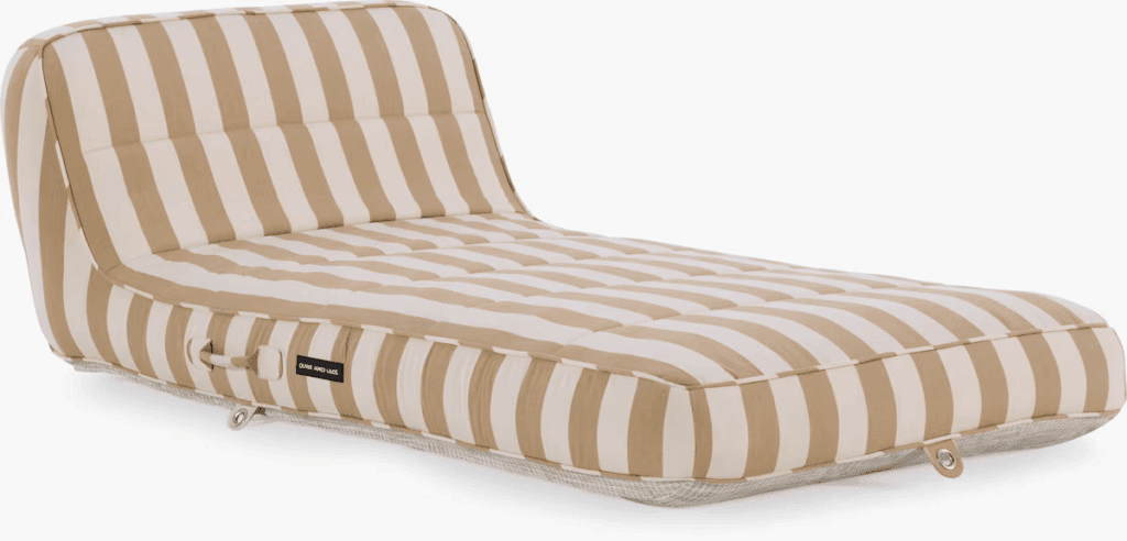Striped outdoor lounge cushion in neutral colors designed for relaxation.