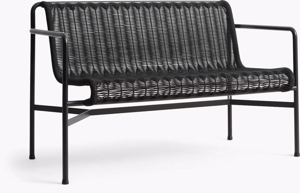 A stylish black outdoor bench with a woven seat and backrest, designed for comfort and elegance.