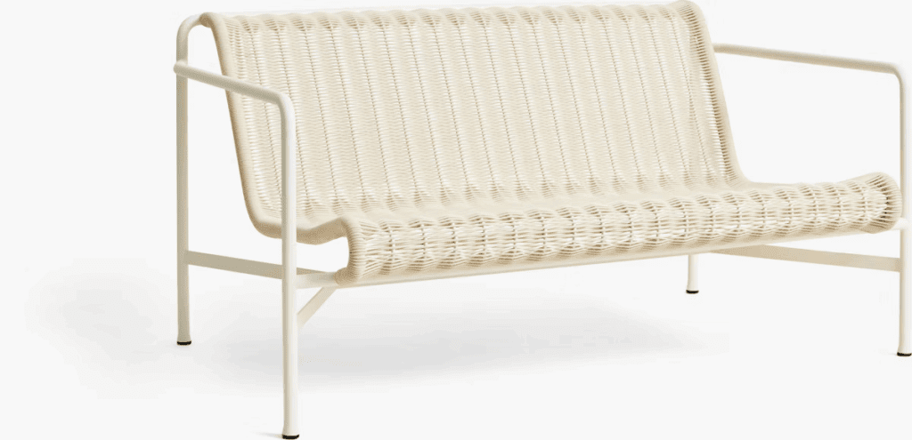 Contemporary outdoor loveseat in a neutral color with minimalist design, made of woven material and metal frame.