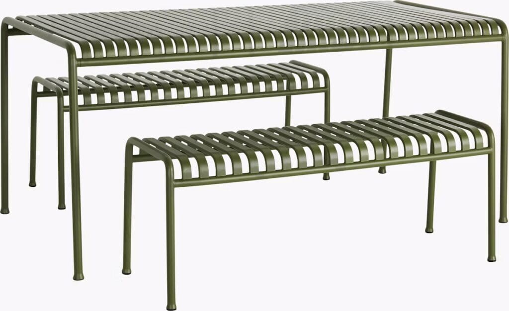 Three modern green metal benches with a slatted design, including a larger rectangular table and two smaller benches.