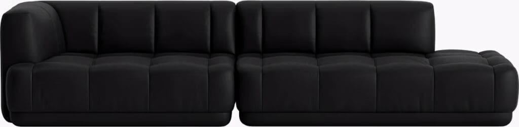 A modern black sectional sofa featuring a sleek design with tufted cushions.