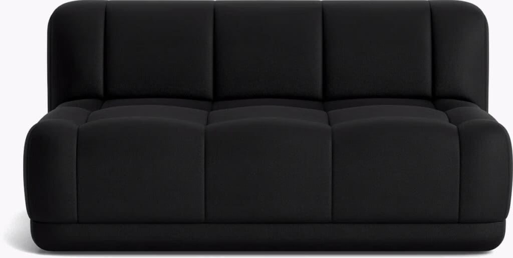A sleek black sofa with a modern design, featuring tufted upholstery and a minimalist aesthetic.
