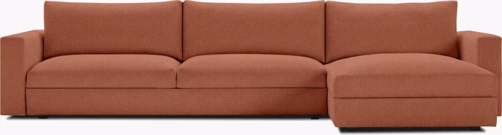 A contemporary orange sectional sofa with clean lines and a modern design.