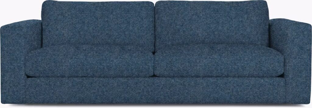 A modern blue couch featuring plush cushions and a contemporary design, ideal for stylish living spaces.