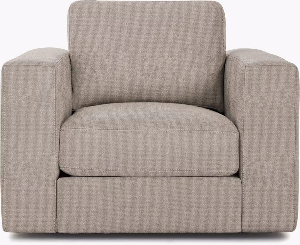 A modern and comfortable armchair with a square design and light gray upholstery, featuring thick arms and a plush seat cushion.
