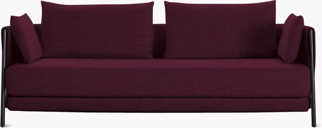 A modern burgundy sofa featuring a sleek design and black legs with comfortable back cushions.