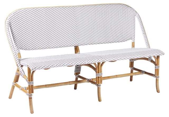 White and black patterned outdoor bench with a curved backrest and bamboo legs.
