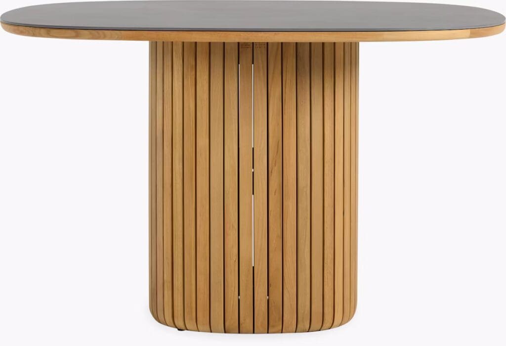 A round wooden dining table with a slatted cylindrical base, featuring a smooth black tabletop.