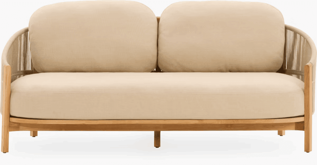 A modern two-seat outdoor sofa with rounded cushions and a natural wood frame, featuring a sleek, minimalist design.