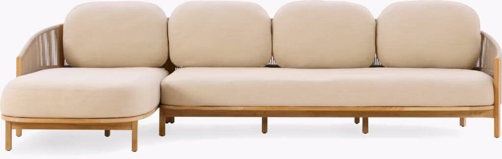A modern beige sectional sofa with rounded cushions and wooden frame, featuring a unique backrest design.