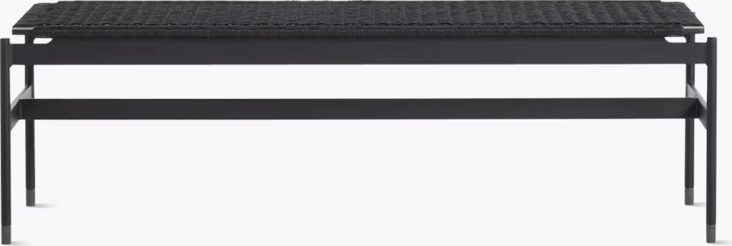 Black woven bench with a sleek metal frame, showcasing a modern and minimalist design.