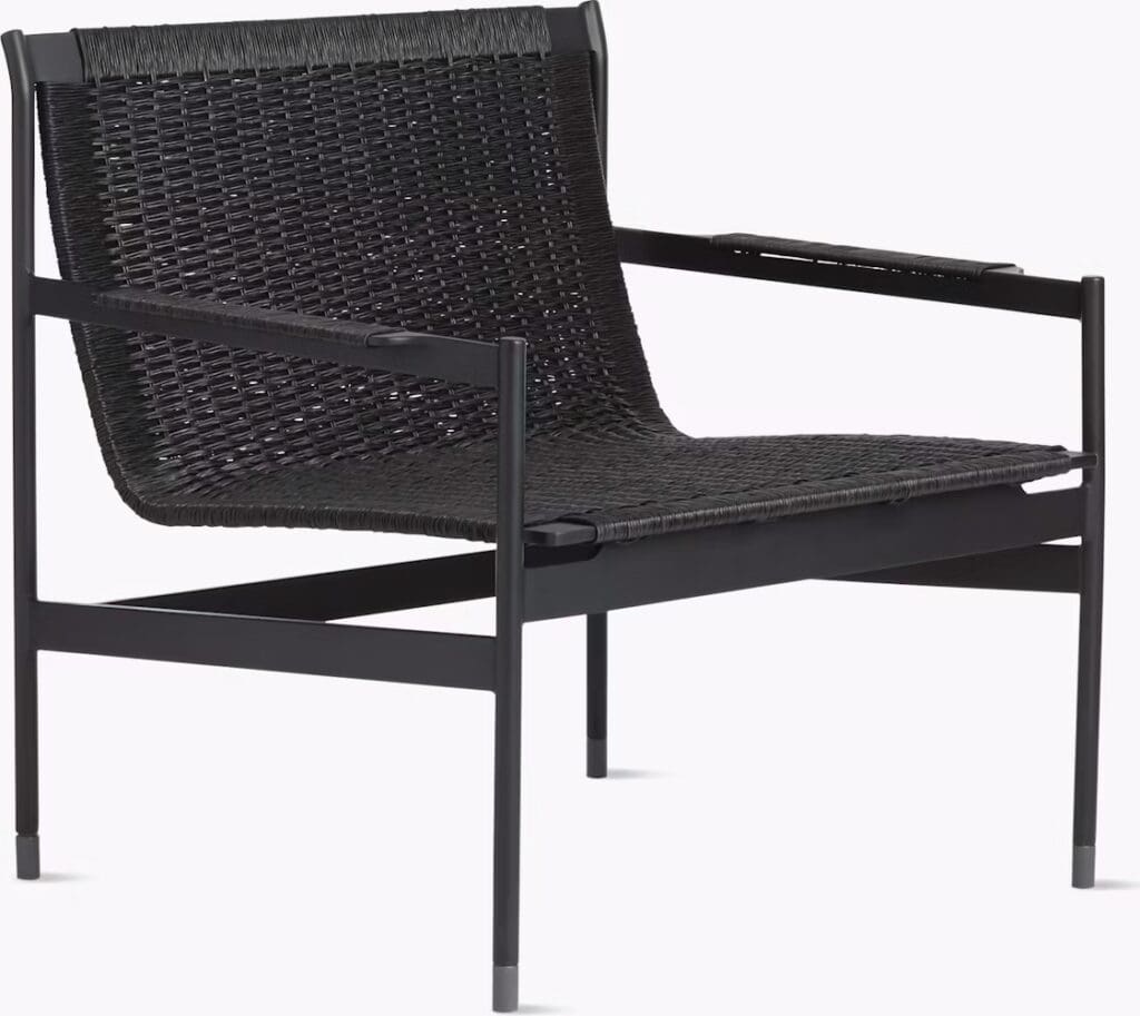 A modern black armchair with a woven seat and backrest, featuring a sturdy frame.