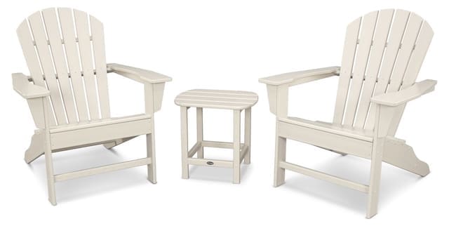 Two white Adirondack chairs and a small side table arranged together, designed for outdoor seating.