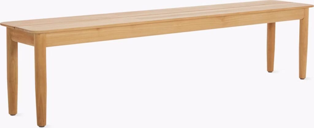 A simple wooden bench with a smooth top and sturdy legs, designed for functional seating or decorative use.