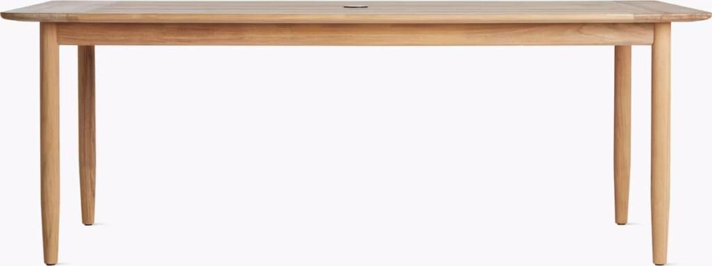 A modern wooden dining table with a clean design, featuring tapered legs and a smooth surface, ideal for contemporary dining spaces.