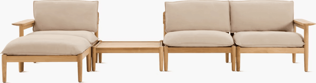 Modern outdoor lounge chair set with beige cushions and wooden frame, featuring a connected side table.