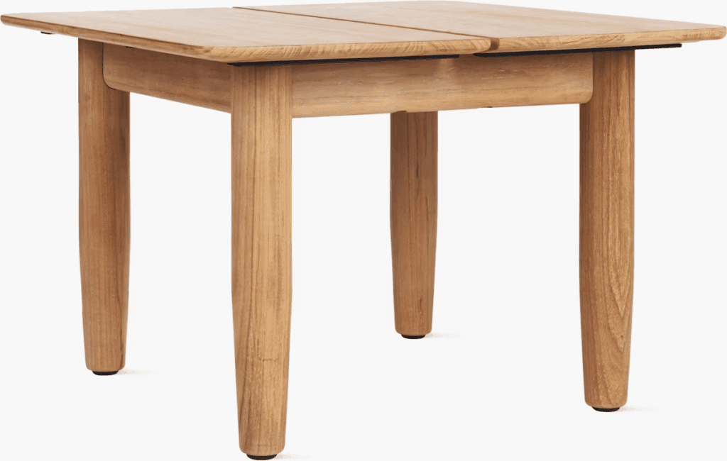 Minimalist wooden outdoor dining table with a natural finish and four sturdy legs.