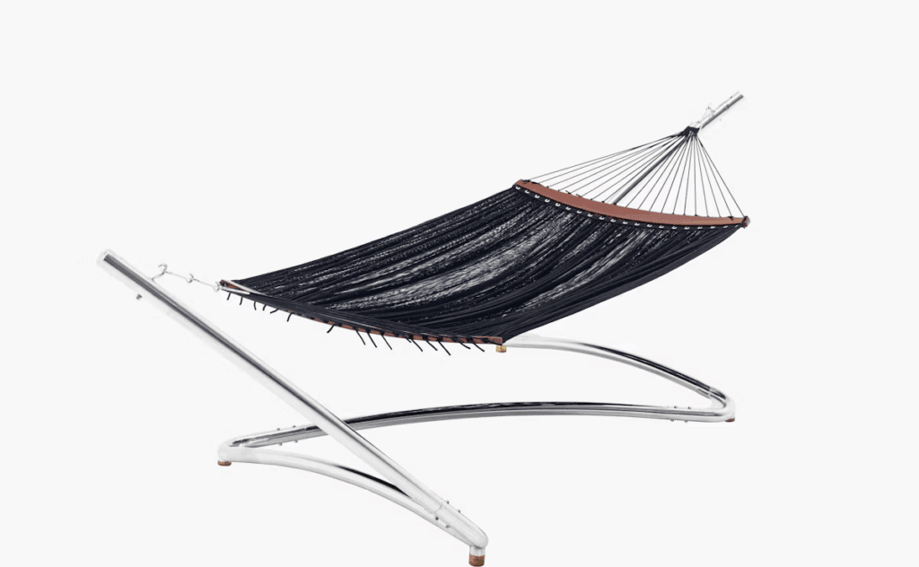 Modern hammock with a sleek chrome frame and dark fabric, designed for outdoor relaxation.