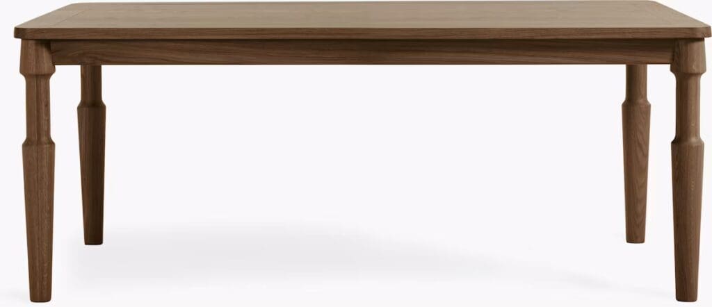 Wooden dining table with four legs, featuring a minimalist design and natural finish.