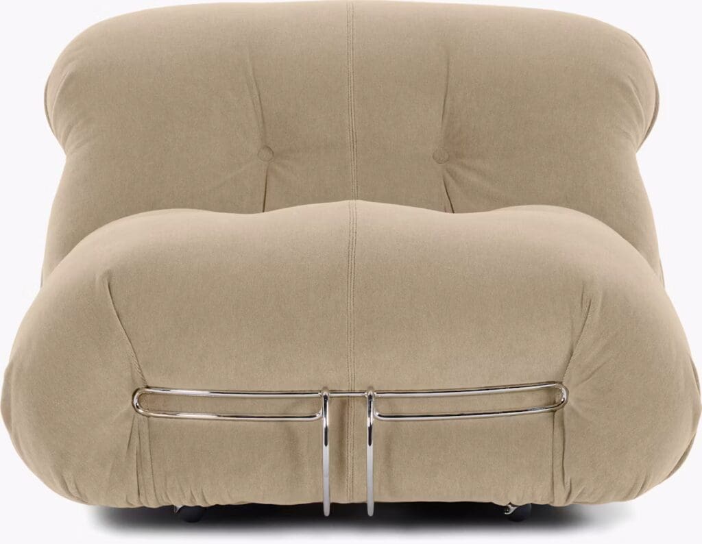 Front view of a modern, beige upholstered lounge chair with a rounded design and chrome accents.