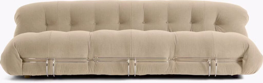 Beige tufted sofa with a modern design, featuring a smooth surface and metal accents.