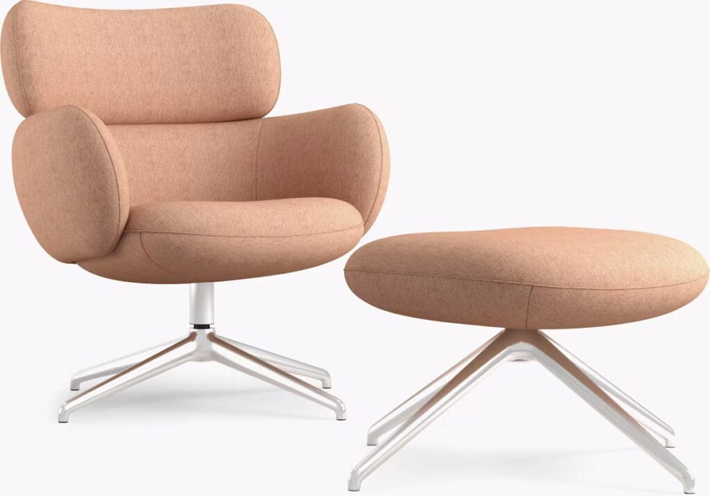 Modern armchair in a soft peach fabric with a matching ottoman, featuring a sleek silver base.