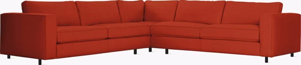 A contemporary red sectional sofa with clean lines and plush cushions, designed for comfort and style.