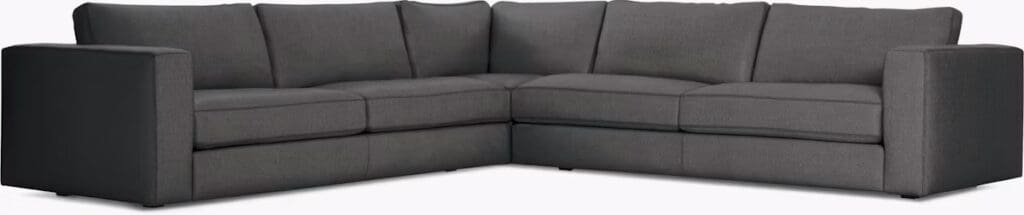 Dark grey modern sectional sofa with clean lines and plush cushions.