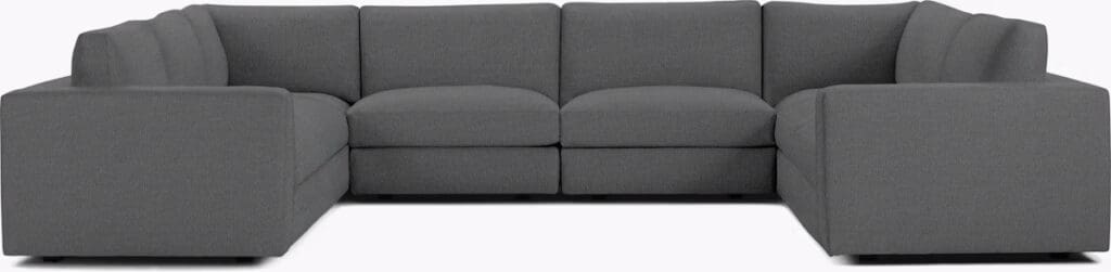 Modern gray sectional sofa with a comfortable design, featuring a low profile and clean lines.