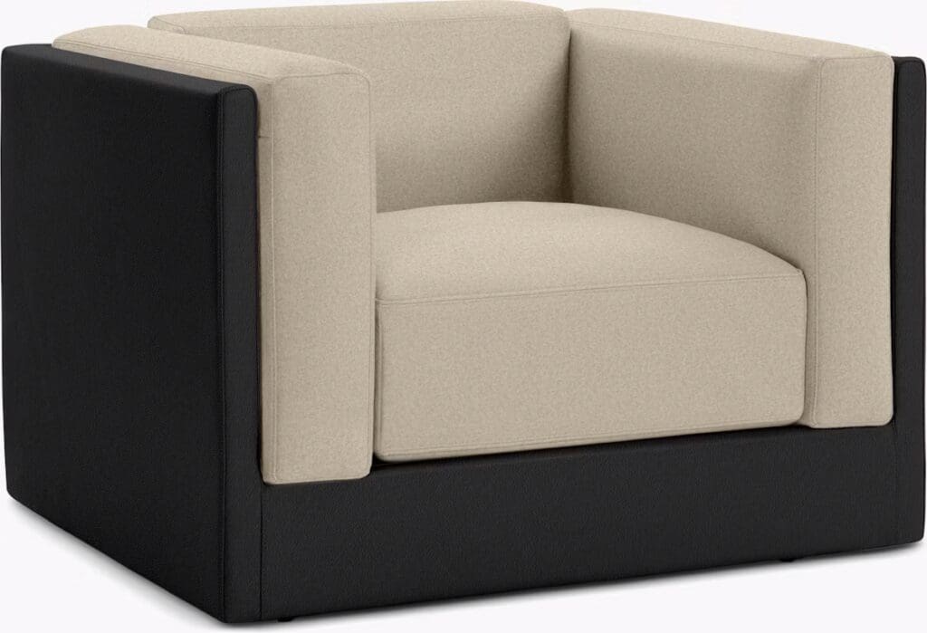 Contemporary armchair featuring a beige cushion with a black leather frame, showcasing a modern design.