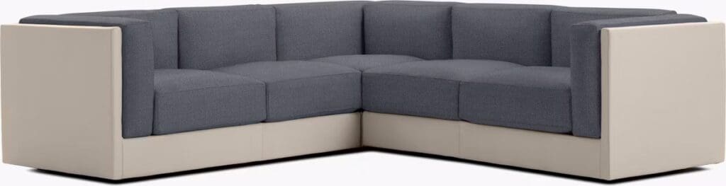Corner sofa with a combination of gray fabric and cream leather upholstery, featuring a modern design.