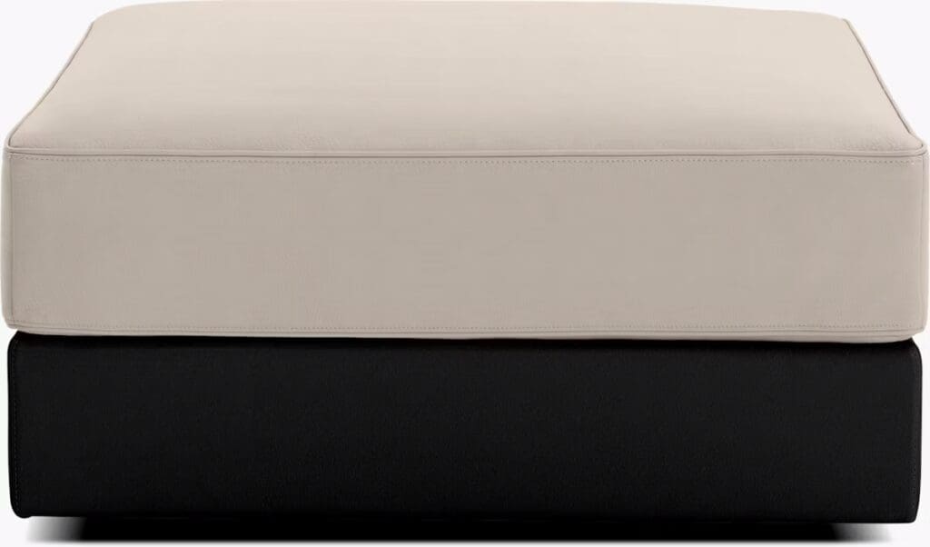 Two cushion tops in contrasting colors, beige on top and black underneath, showcasing a modern design.