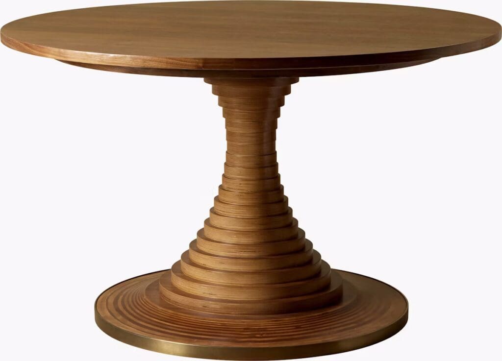 Round wooden dining table with a sculptural, spiral-shaped base.