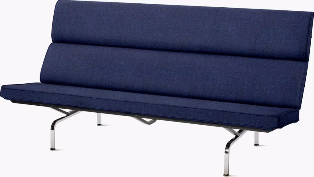 A modern navy blue sofa with a sleek design and metal legs.