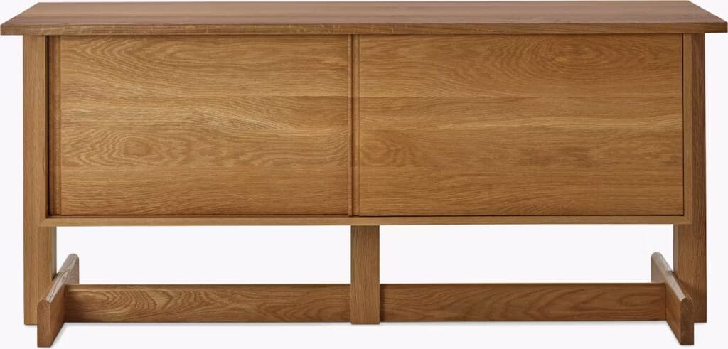 Modern oak storage cabinet with two sliding doors and a minimalist design.