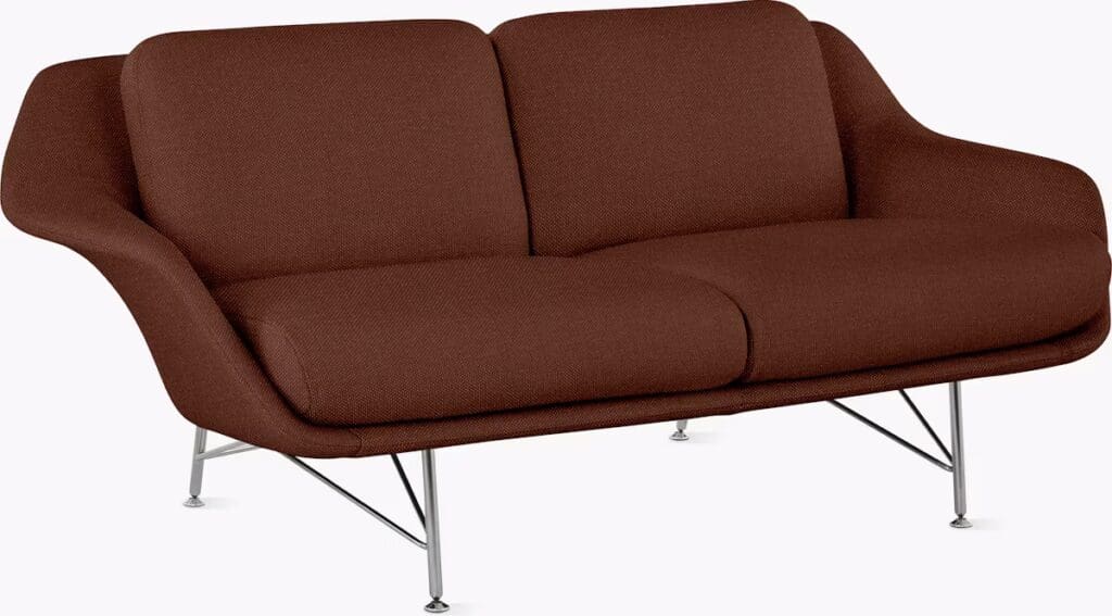 A stylish brown sofa with a modern design, featuring a smooth upholstery and sleek metal legs.