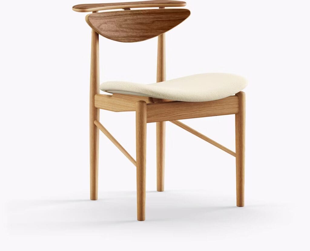 Modern wooden chair with a curved wooden backrest and a cream-colored seat cushion.