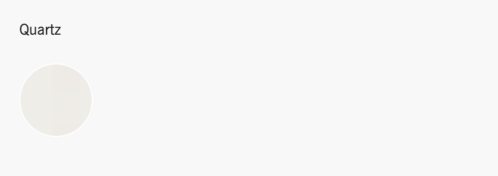 Color sample of Quartz, displayed as a circular swatch on a neutral background.