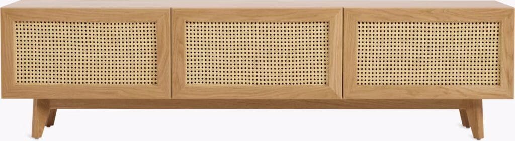 A modern wooden media cabinet featuring cane front panels and set on tapered legs.